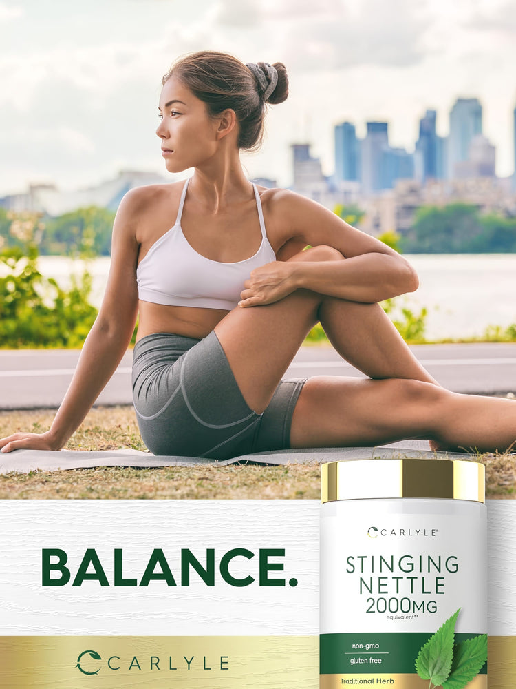 A young woman practices outdoor yoga seated with a Carlyle Stinging Nettle 2000MG bottle beside her.