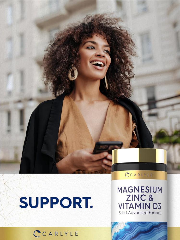 Young woman smiling and looking away while holding a smartphone, next to a Carlyle Magnesium Zinc & Vitamin D3 bottle.