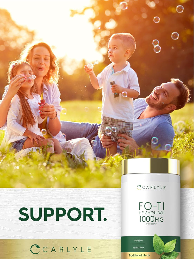 A family enjoys playing with bubbles in a sunny field alongside a Fo-Ti bottle.