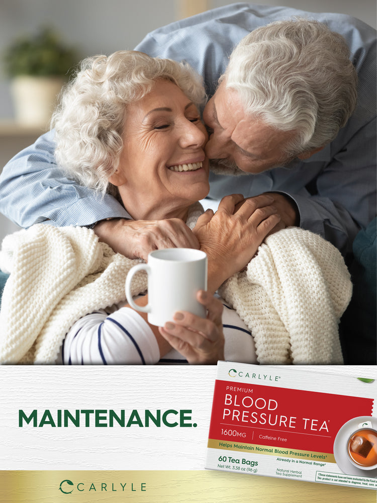 Lifestyle image of smiling older couple embracing, with woman holding a mug, Carlyle Blood Pressure Tea box nearby, and graphic stating MAINTENANCE.