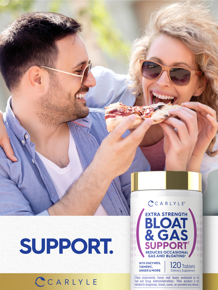 Lifestyle image of two adults sharing pizza outdoors with Carlyle Extra Strength Bloat & Gas Support bottle and graphic stating SUPPORT.
