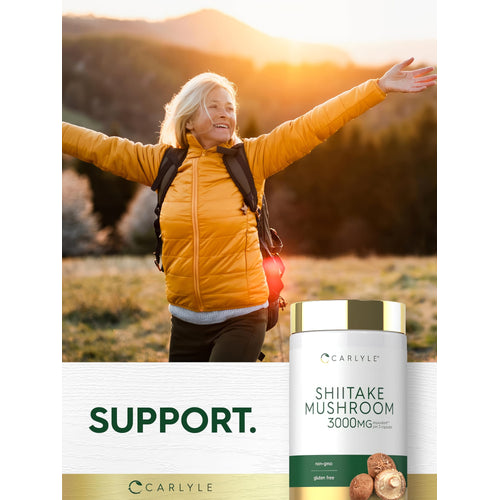 View 6 Senior woman enjoying a hike, arms outstretched, next to a Carlyle Shiitake Mushroom bottle.