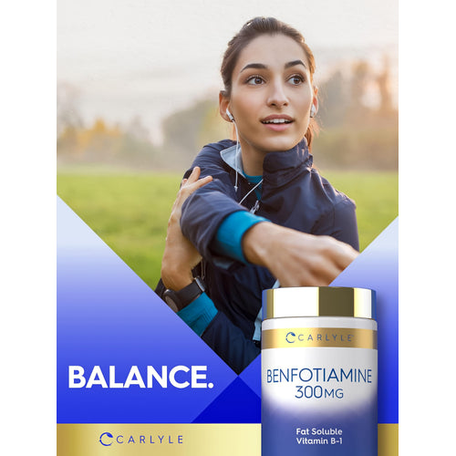 View 6 A young adult woman stretches outdoors with a Carlyle Benfotiamine 300 mg bottle beside her.
