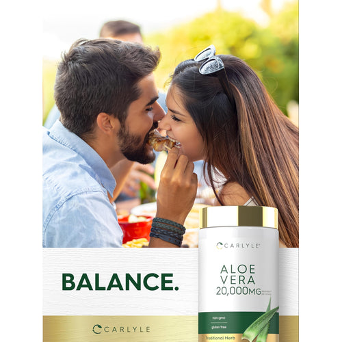 View 6 Young man and woman smiling and sharing food at an outdoor gathering, with a Carlyle Aloe Vera bottle visible.