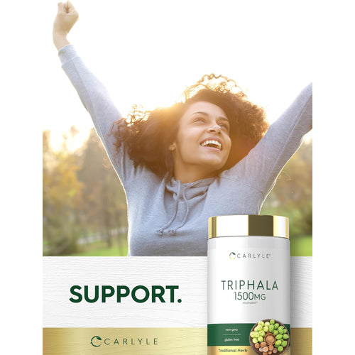 View 6 Young woman outdoors smiling with raised arms next to a Triphala bottle.