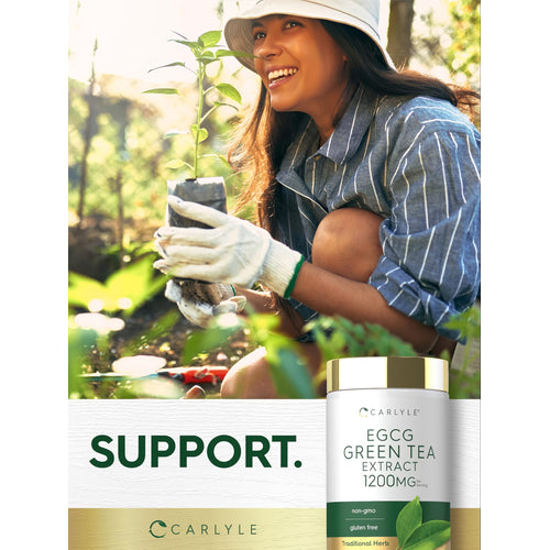 View 6 A young adult woman gardening and smiling with an EGCG Green Tea Extract bottle in hand.