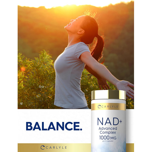 View 6 A woman outdoors smiling with arms outstretched next to a NAD Collagen Resveratrol bottle.