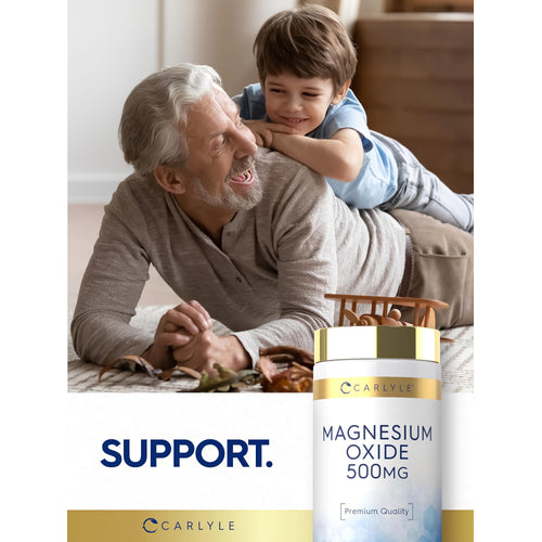 View 6 Older man and young boy laughing and playing on the floor with a Carlyle Magnesium Oxide 500 mg bottle nearby.
