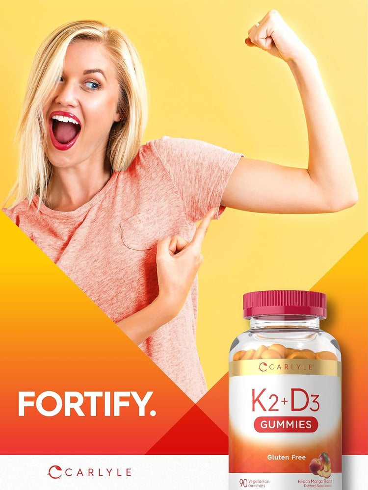 A young blonde woman flexes her bicep and points to it, with a Carlyle K2+D3 Gummies bottle beside her.