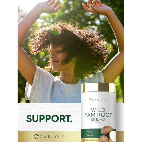 View 6 Young woman with curly hair smiles with eyes closed, arms raised, enjoying sun next to a bottle of Wild Yam Root.