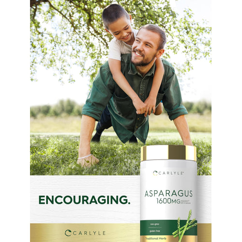 View 6 A man plays with a boy on his back in a grassy park, next to an Asparagus extract bottle.