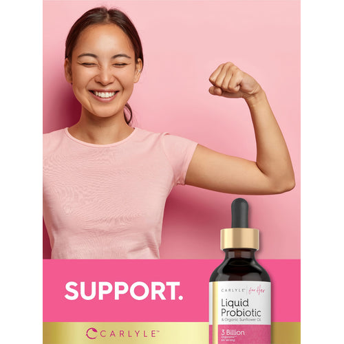 View 6 A young Asian woman smiling with eyes closed, flexing her bicep, and a Carlyle Liquid Probiotic bottle in the foreground.