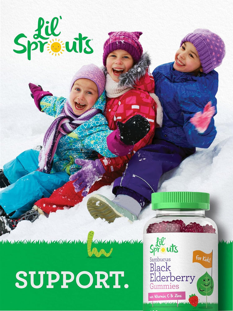 Three children smiling and playing in the snow with a Lil' Sprouts Black Elderberry Gummies bottle nearby.