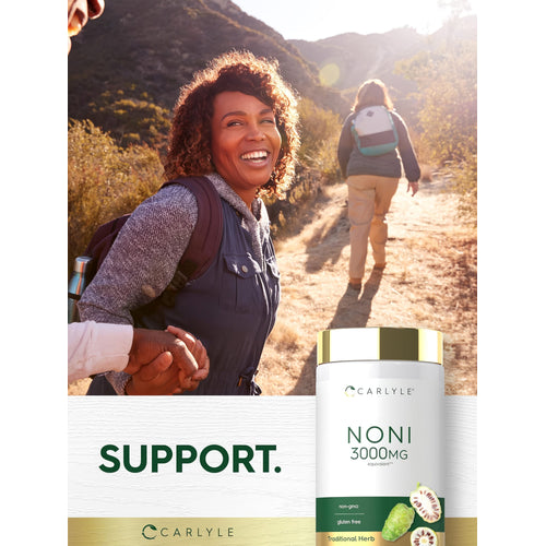 View 6 Middle-aged woman hiking on a sunny trail, holding hands, with a Carlyle Noni bottle prominent in the foreground.
