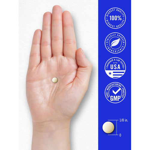 View 7 A light yellow round tablet rests in the palm of a hand, approximately 1/8 inch in size.