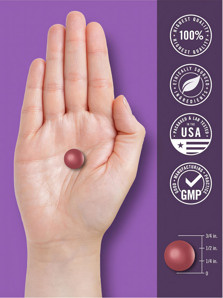 A round, reddish-purple melatonin gummy is on the palm of a hand, measuring 1/2 inch in diameter.