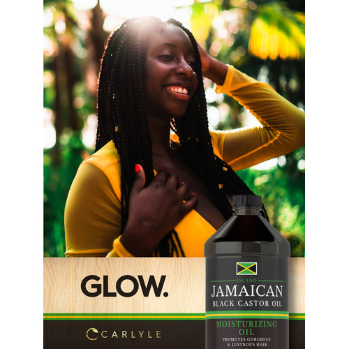 View 10 Lifestyle image of smiling woman with long braided hair, Jamaican Black Castor Oil bottle, and graphic stating GLOW.