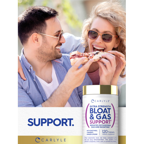 View 11 Lifestyle image of two adults sharing pizza outdoors with Carlyle Extra Strength Bloat & Gas Support bottle and graphic stating SUPPORT.