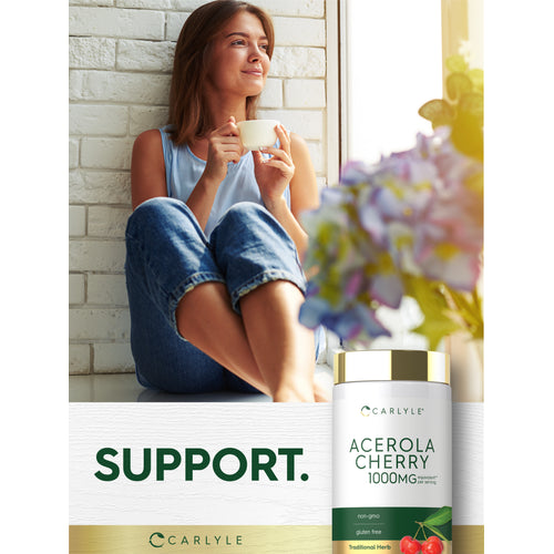 View 10 Lifestyle image of woman holding a cup by a window with Carlyle Acerola Cherry 1000MG bottle nearby and graphic stating SUPPORT.