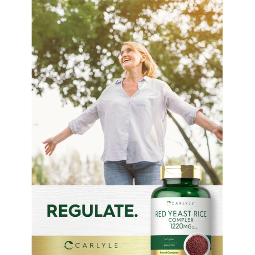 View 12 Lifestyle image of a smiling woman outdoors with Red Yeast Rice Complex 1220MG bottle and graphic stating REGULATE.