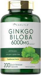 A hand holding Carlyle Ginkgo Biloba 6000 mg equivalent Quick Release Capsules, 200 count.