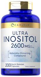 Hand holding Quick Release Capsules, 2600 mg per serving, 200 count, on a bulk scale.