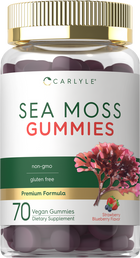 A hand holds a bulk scale displaying Carlyle Sea Moss 70 Vegan Gummies.