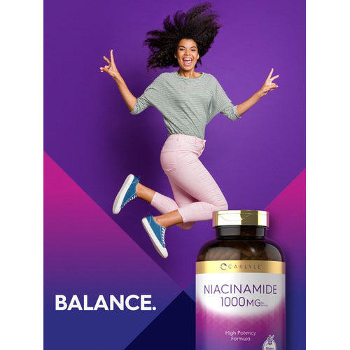View 6 A young woman jumps making peace signs next to a Carlyle Niacinamide bottle with the text 'BALANCE.'