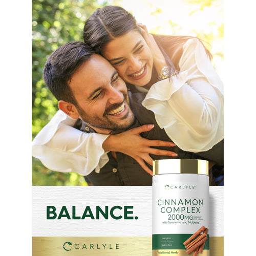 View 6 A joyful couple embraces and laughs, holding a Carlyle Cinnamon Complex bottle.