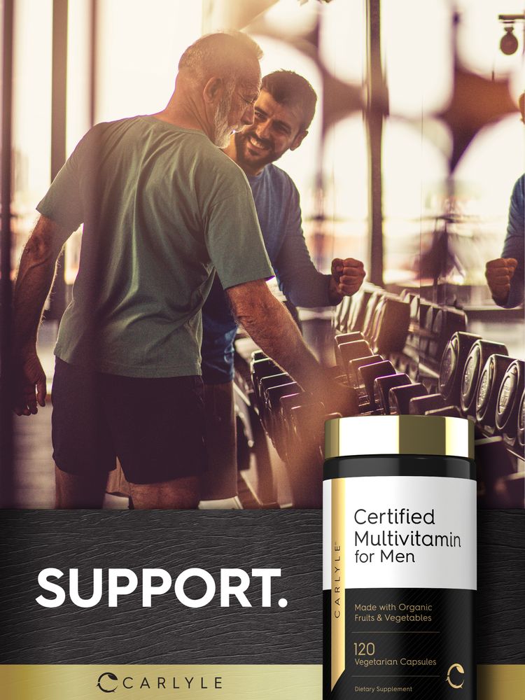 An older man and a younger man smiling in a gym next to a Certified Multivitamin for Men bottle.