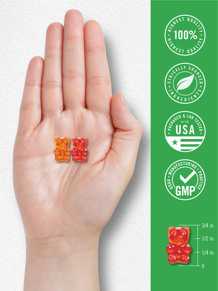 Two kids' multivitamin gummies are on a hand, with a scale showing one gummy is 3/4 inch tall.