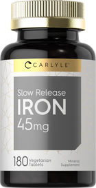 Carlyle Slow Release Iron 45mg with 180 vegetarian tablets shown on a hand scale for size reference.