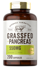 A hand holding a bottle of Grassfed Pancreas 550 mg, containing 200 capsules.