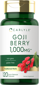 A hand holding Goji Berry 1,000MG Quick Release Capsules by a bulk scale.